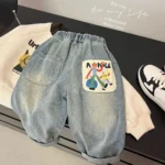 2026 New Spring Childrens Pants Fun Cartoon Print Patch Pocket Boys Jeans Elastic Waist Loose Denim Trousers
