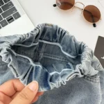 2026 New Spring Childrens Pants Fun Cartoon Print Patch Pocket Boys Jeans Elastic Waist Loose Denim Trousers