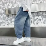 2026 New Spring Childrens Pants Fun Cartoon Print Patch Pocket Boys Jeans Elastic Waist Loose Denim Trousers